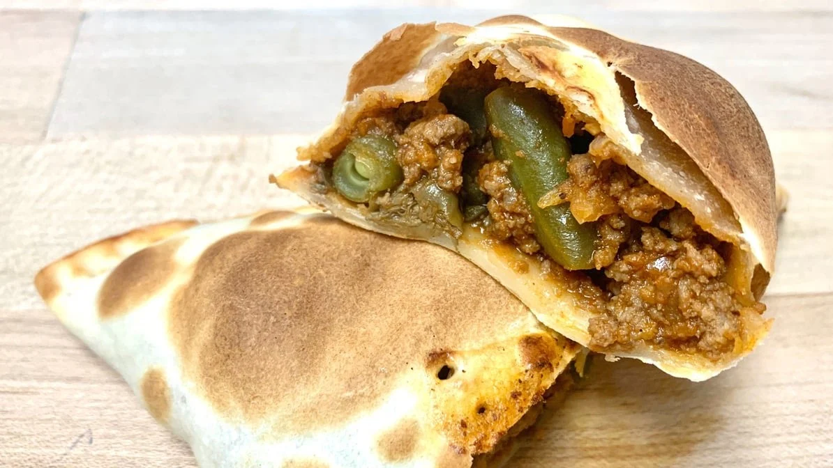Argentinian Beef Empanada - Savory empanada filled with seasoned Argentinian beef.